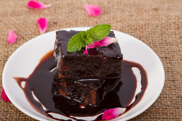 Delicious chocolate cake on white plate
