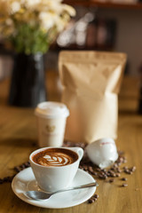 Coffee such as a cappuccino cup, seed and coffee package.