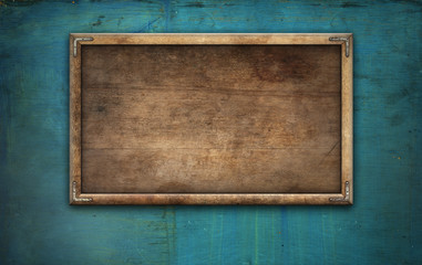 Old wooden picture frame on wall
