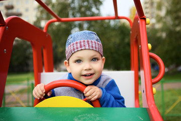 Fototapeta na wymiar Boy Playing on Playground