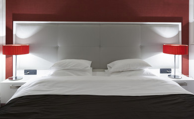 Hotel bedroom interior in the evening