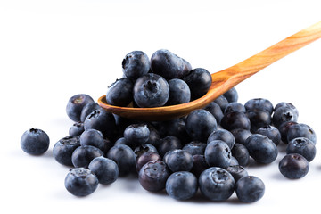 Fresh blueberries in wooden spoon