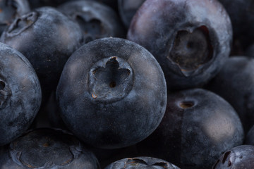 Blueberries on stone plate background