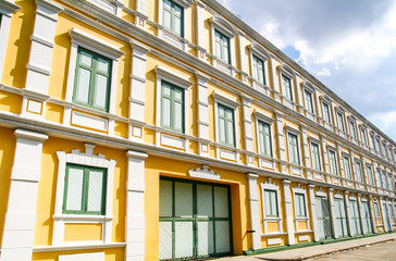 Fototapeta na wymiar Yellow building with many windows