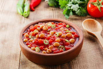 cooked chickpeas with tomatoes in a bowl