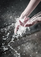hands with water splash