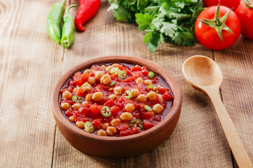 cooked chickpeas with tomatoes in a bowl