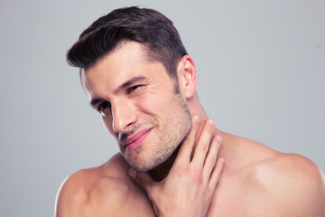 Naklejka premium Portrait of a handsome man with neck pain