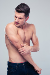 Handsome man having shoulder pain