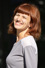 Fototapeta premium young woman wrinkled face from the sun and smiling