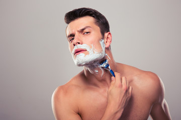 Young man shaving