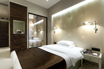 Fototapeta na wymiar Interior of a luxury double bed hotel bedroom