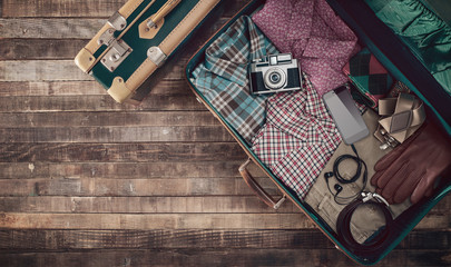 Hipster traveler's suitcase