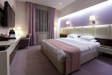 Interior of a luxury double bed hotel bedroom