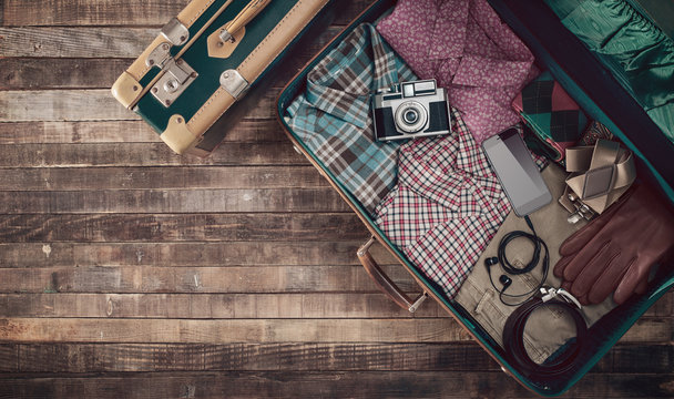 Hipster traveler's suitcase