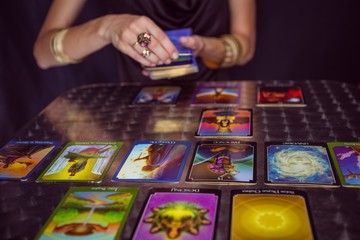 Fortune teller forecasting the future with tarot cards - obrazy, fototapety, plakaty