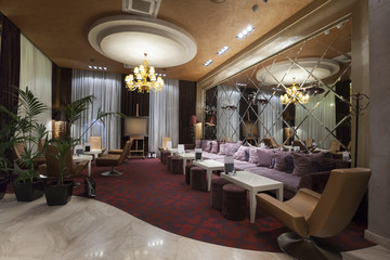 Fototapeta na wymiar Interior of a hotel lobby with cafe 