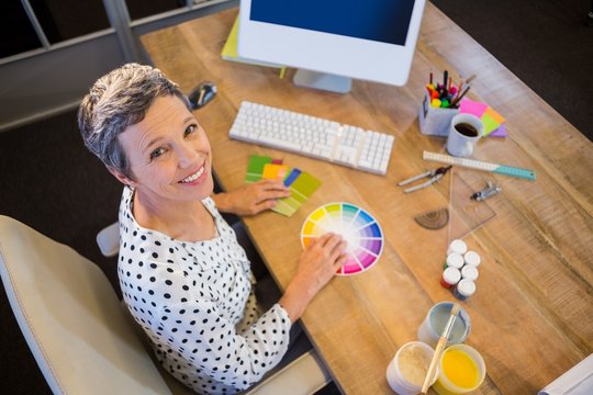 Casual businesswoman working with colour chart