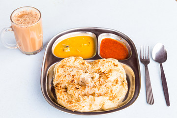 Roti Prata or Roti Canai, a traditional Indian bread served with curry