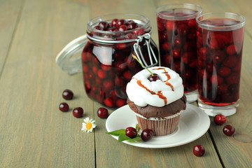 Compote of cherries on wooden background
