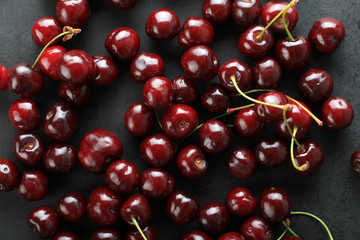 Fresh sweet cherries on a black background