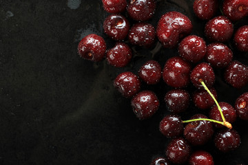 Fresh sweet cherries on a black background