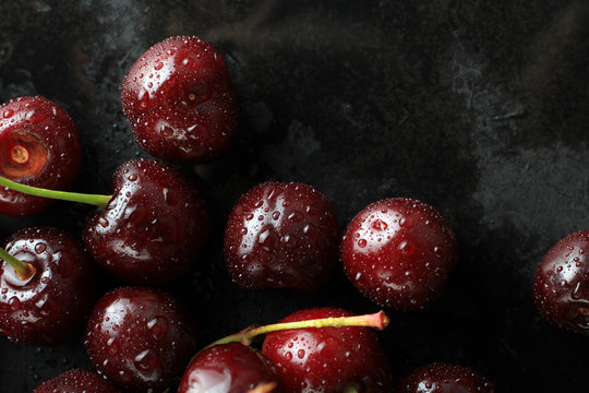 Fresh sweet cherries on a black background