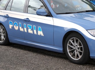 italian blue police car in the road