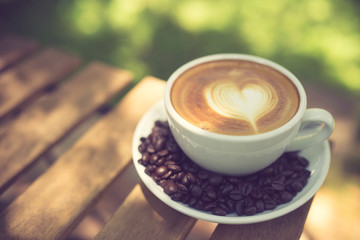 Latte Art coffee with coffee bean vintage color