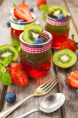 Red and green jelly served with fruit