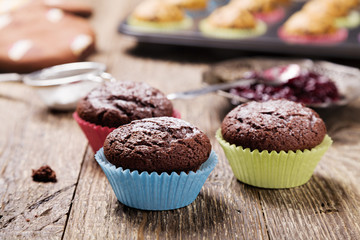 muffins with chocolate in colorful molds