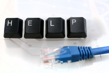 IT HELP Four Keyboard Keys with Network Cable on White Glass