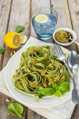 Homemade spinach pasta with pesto