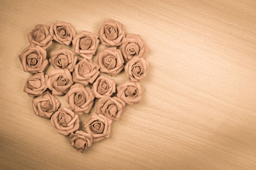 red heart shape on wood background