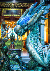 Blue dragon in a temple. Vietnam.