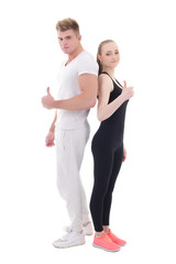 young man and woman in sportswear thumbs up isolated on white