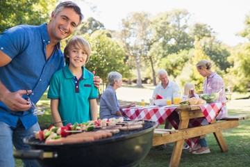 Happy family having picnic in the park 