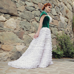 A woman like a princess in an vintage dress in fairy park