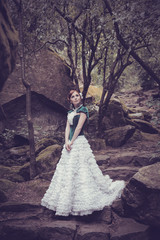 A woman like a princess in an vintage dress in fairy park
