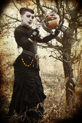 Naklejka premium Mysterious dark woman in forest. Book cover