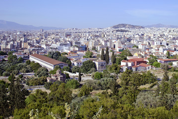 Fototapeta na wymiar cityscape of Athens Greece with the Stoa of Attalos view and an old church
