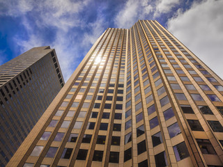 Glass and granite skyscraper building reaching for the sky in perspective