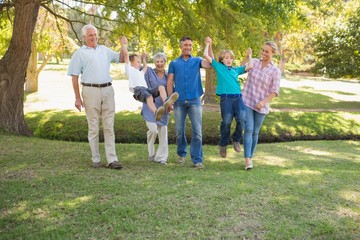 Happy family playing together in the park
