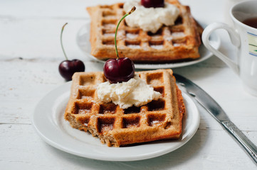 Breakfast with wholegrain waffles and whipped cream