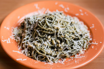 Delicious pasta with pesto, nuts and cheese 