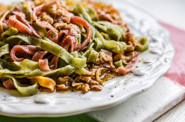 Delicious color pasta with bakon and tomatoes