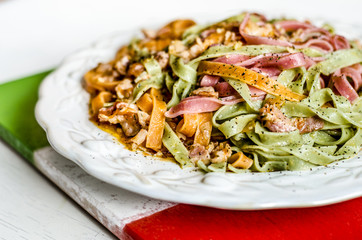Delicious color pasta with bakon and tomatoes