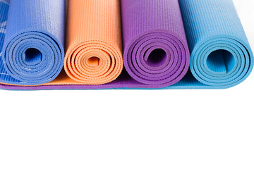 Colorful yoga mat and on white background