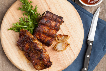 Barbecue pork  ribs on a white plate.