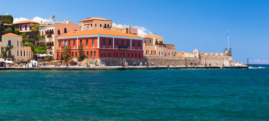 Fototapeta na wymiar Old town main quay with colorful buildings. Crete, Greece